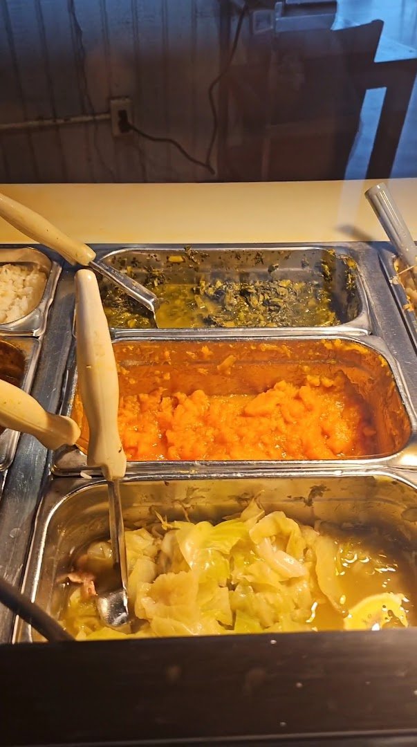 Plates of fried chicken and cornbread on display.